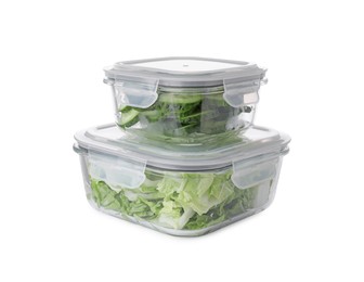 Photo of Glass containers with fresh cabbage and cucumbers isolated on white