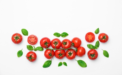 Photo of Flat lay composition with ripe tomatoes on light background