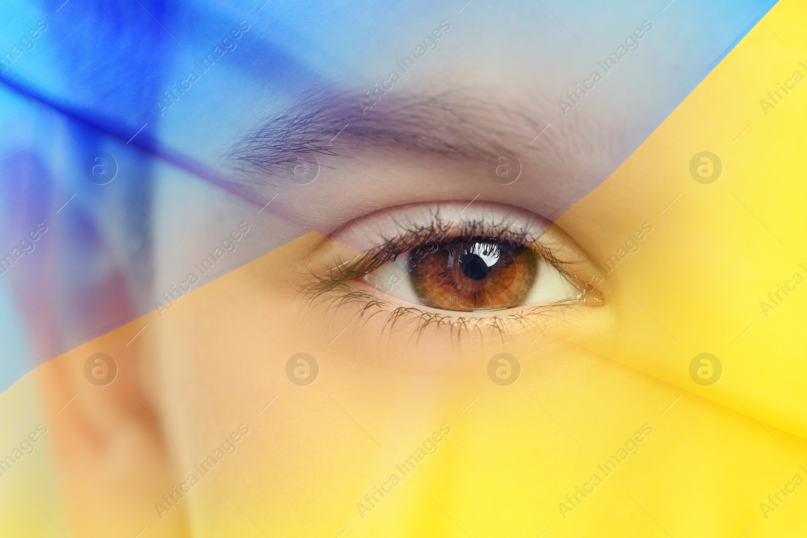 Image of Double exposure of Ukrainian national flag and little boy, closeup view