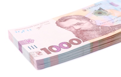 Photo of 1000 Ukrainian Hryvnia banknotes on white background