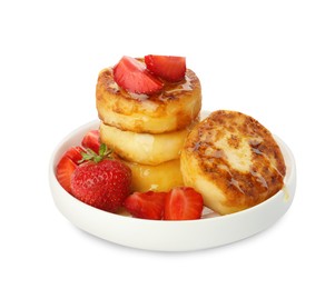 Plate of delicious cottage cheese pancakes with strawberries and honey on white background