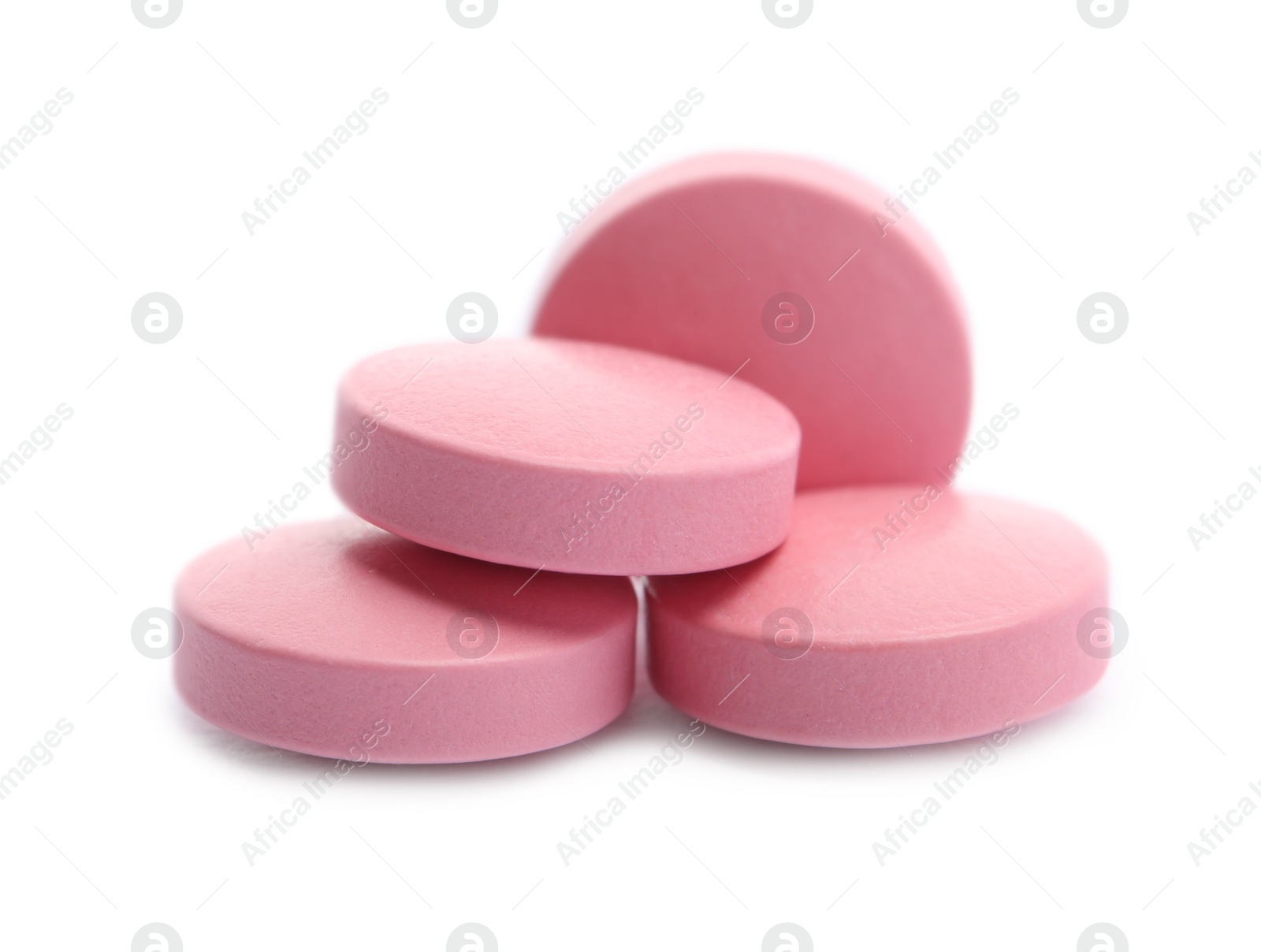 Photo of Pile of color pills on white background