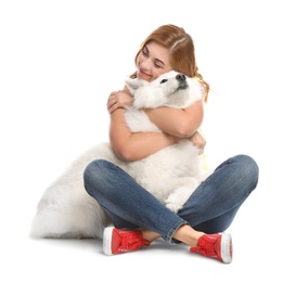 Photo of Beautiful woman hugging her dog on white background