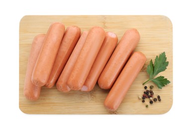 Fresh raw sausages, parsley and spices isolated on white, top view. Meat product