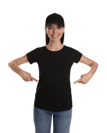 Photo of Young happy woman in black cap and tshirt on white background. Mockup for design