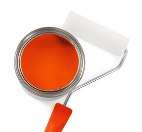 Photo of Can of orange paint and roller on white background, top view