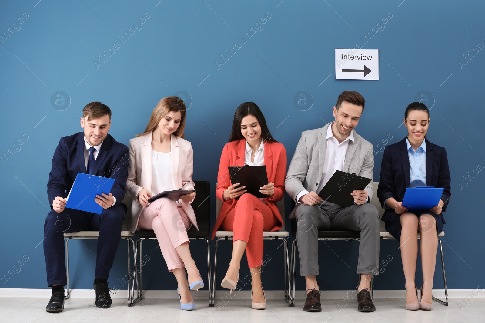 Photo of Group of people waiting for job interview, indoors