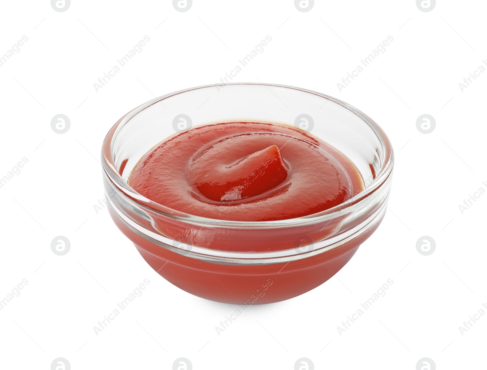 Photo of Glass bowl with tasty ketchup isolated on white