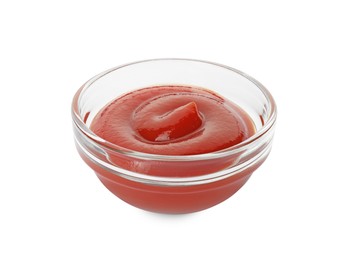 Photo of Glass bowl with tasty ketchup isolated on white