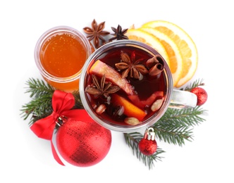 Photo of Aromatic mulled wine, ingredients and decor on white background, top view