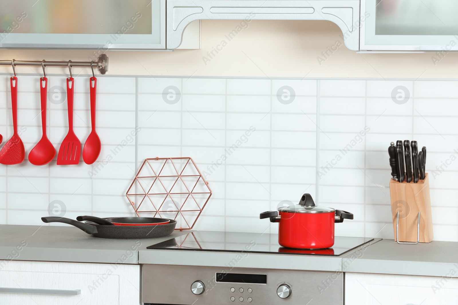 Photo of Clean cookware and utensils in modern kitchen