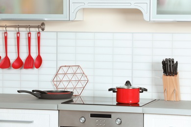 Photo of Clean cookware and utensils in modern kitchen