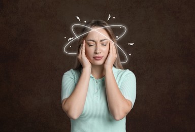 Image of Young woman having headache on brown background
