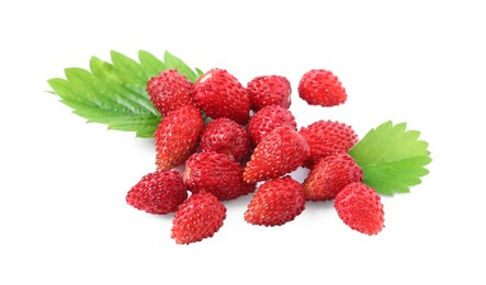 Photo of Ripe wild strawberries and green leaves isolated on white