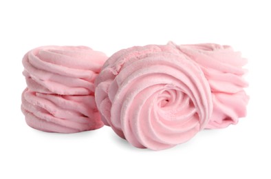 Photo of Many delicious pink zephyrs on white background