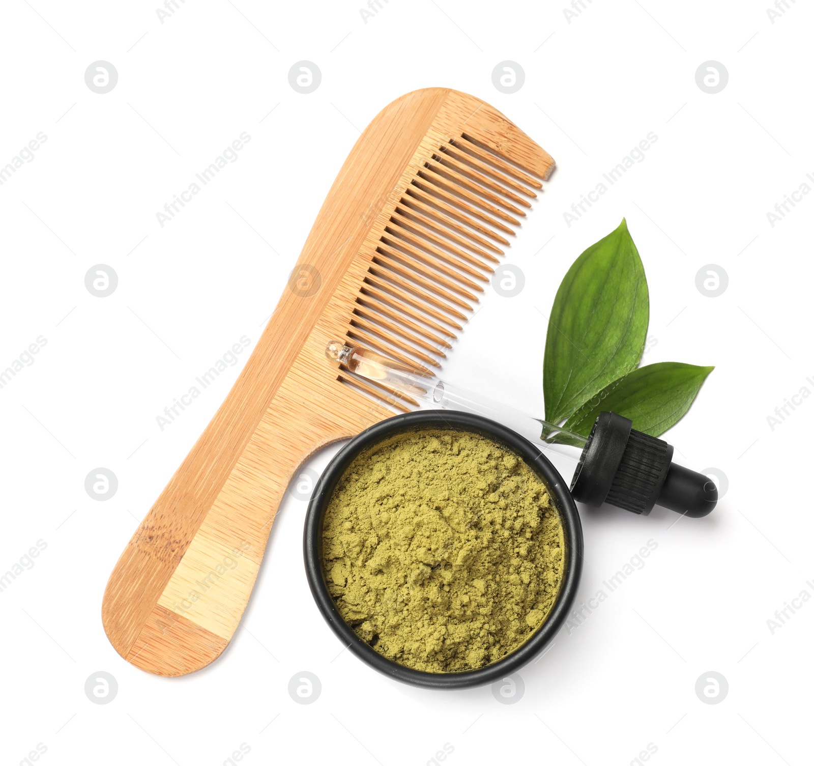 Photo of Henna powder in bowl, comb, green leaves and dropper isolated on white, top view