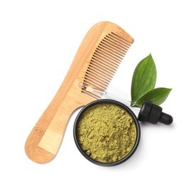 Photo of Henna powder in bowl, comb, green leaves and dropper isolated on white, top view