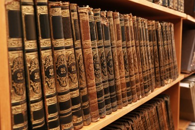 Collection of old books on shelf in library