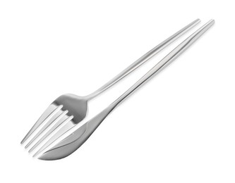 Photo of Fork and knife isolated on white. Stylish shiny cutlery set