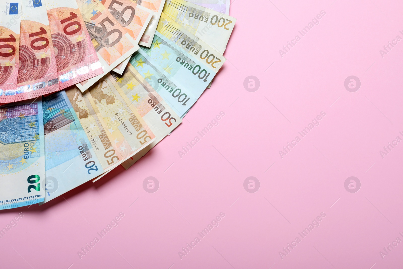 Image of Money on pink background, flat lay. Space for text 