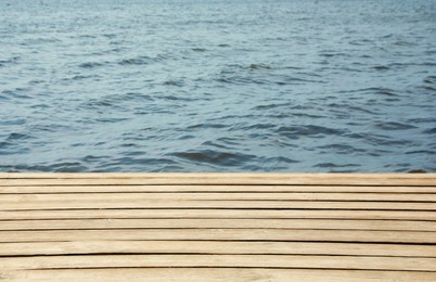 Photo of Wooden pier and river on sunny day