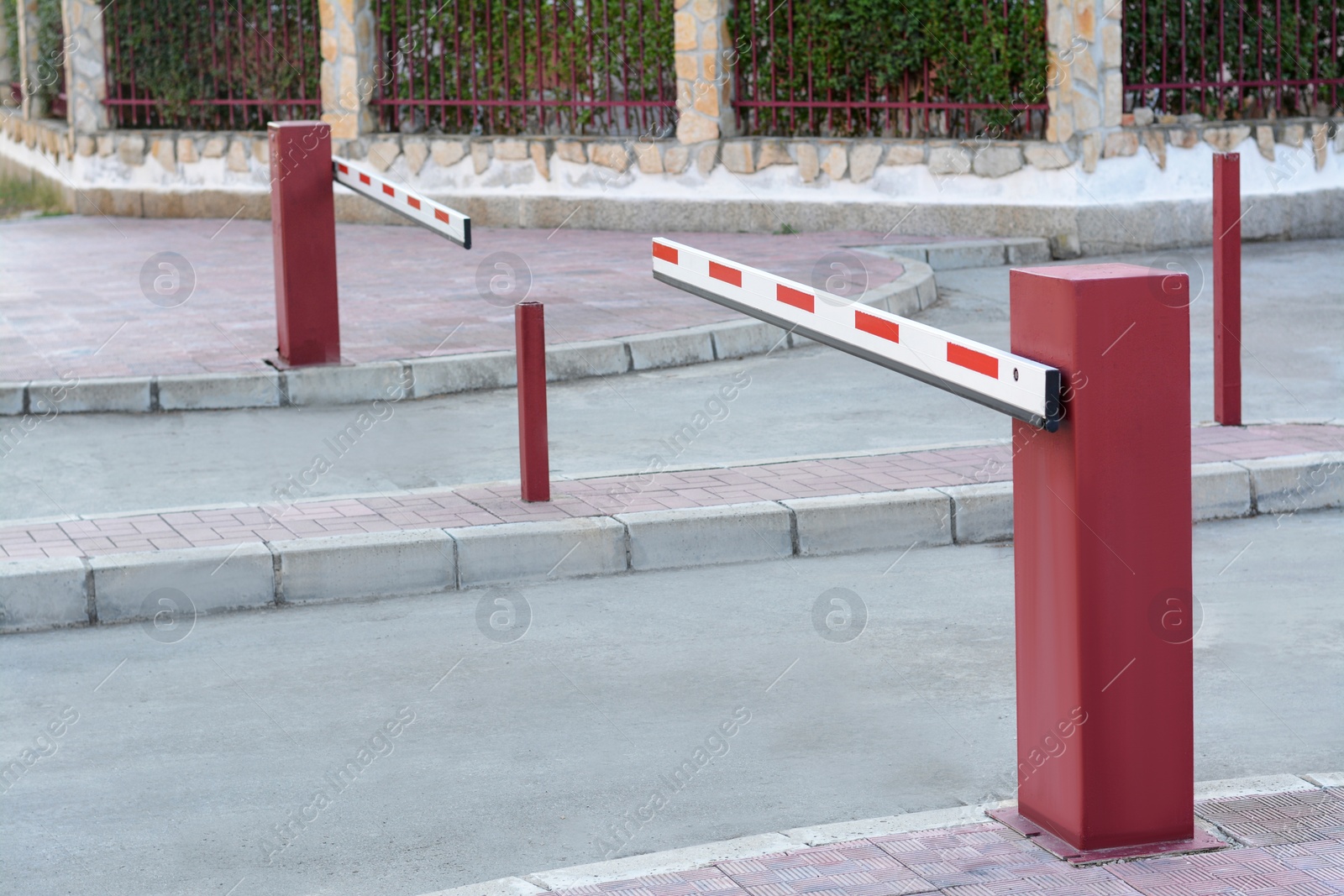 Photo of Closed boom barriers near road on autumn day outdoors