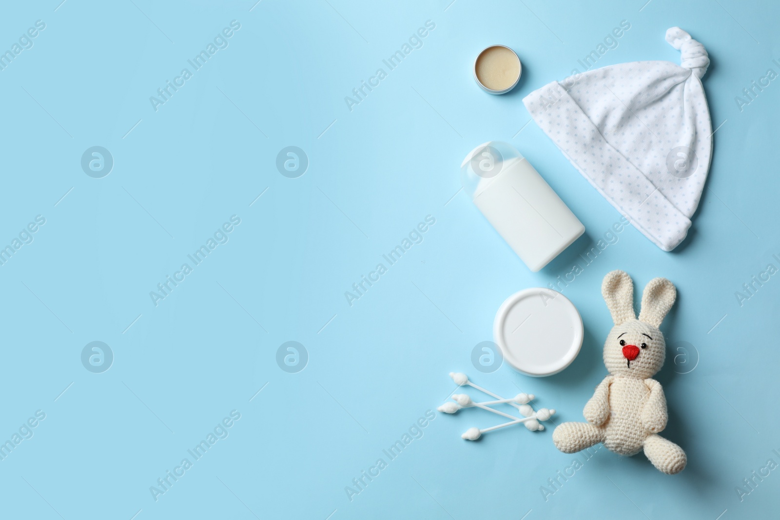 Photo of Flat lay composition with baby accessories and toy on color background. Space for text