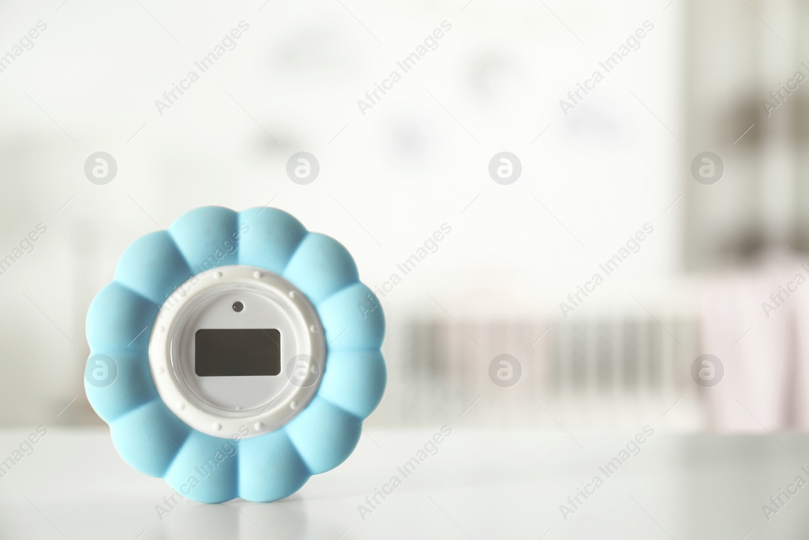 Photo of Digital temperature and humidity control in baby room interior. Space for text