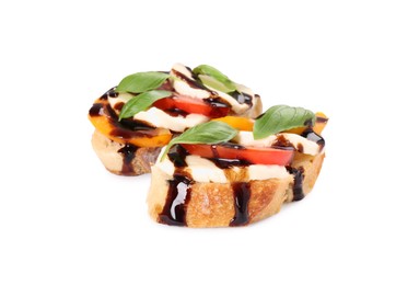 Photo of Delicious bruschettas with mozzarella cheese, tomatoes and balsamic vinegar isolated on white