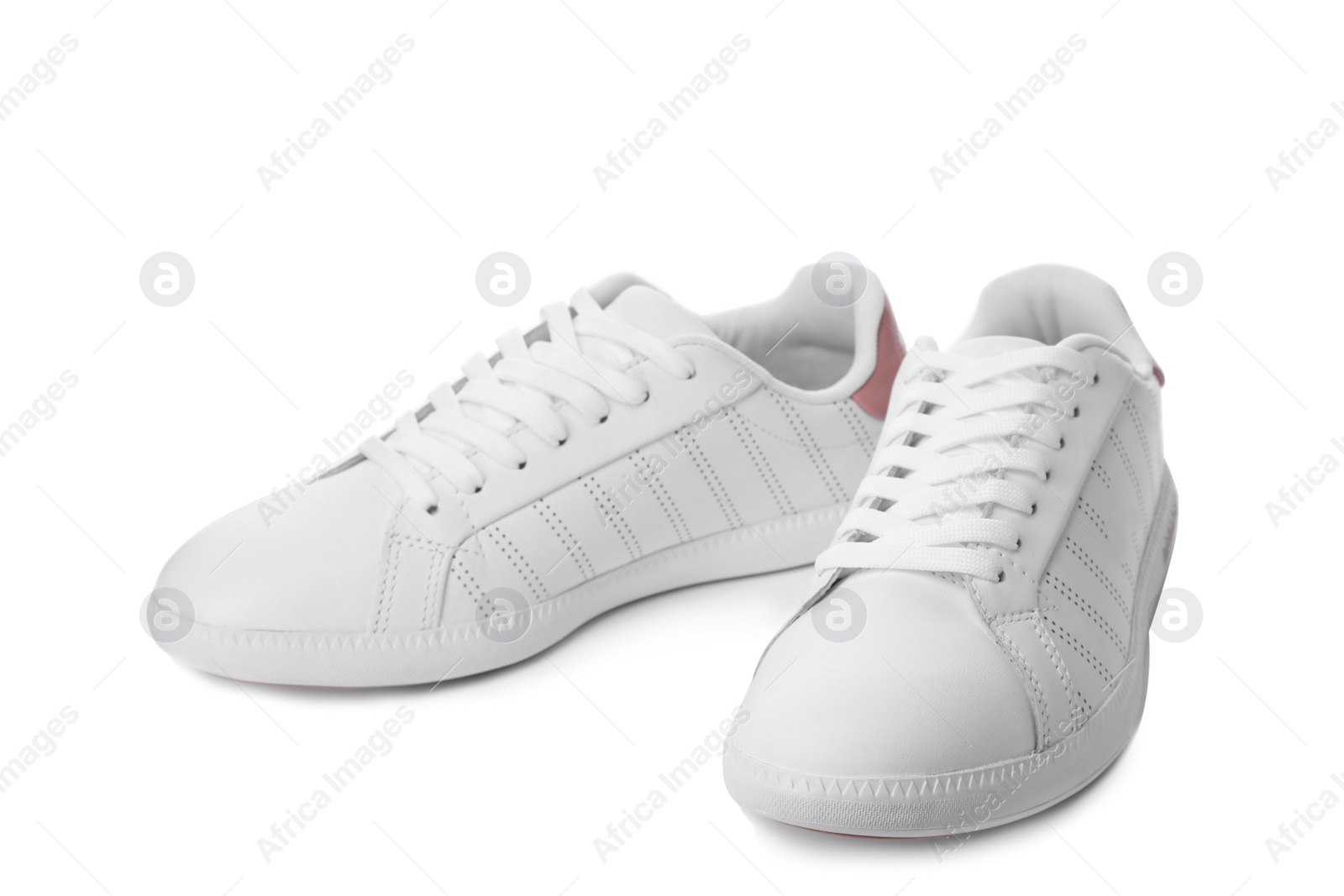 Photo of Pair of trendy sneakers on white background