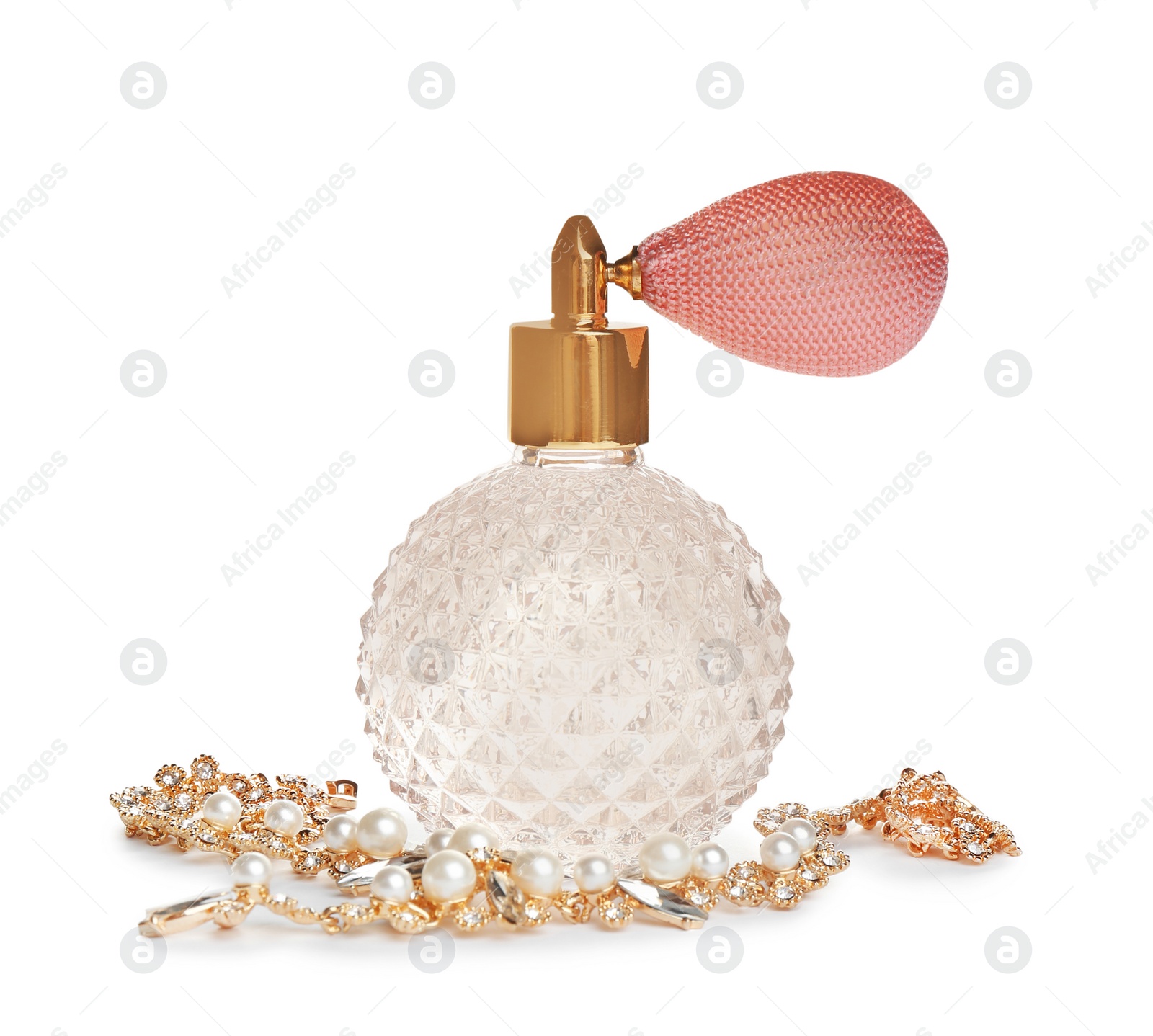 Photo of Glass bottle of perfume and luxury jewellery isolated on white