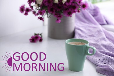 Image of Good morning! Cup of aromatic coffee, beautiful flowers and violet cloth on white table