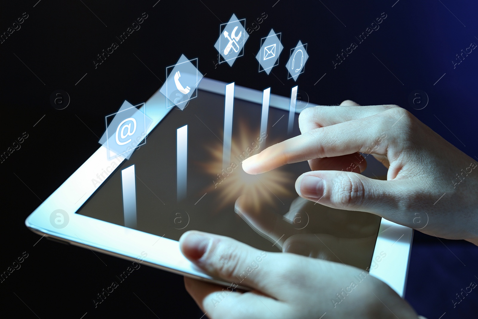 Image of Woman using tablet on dark background, closeup. Technical support