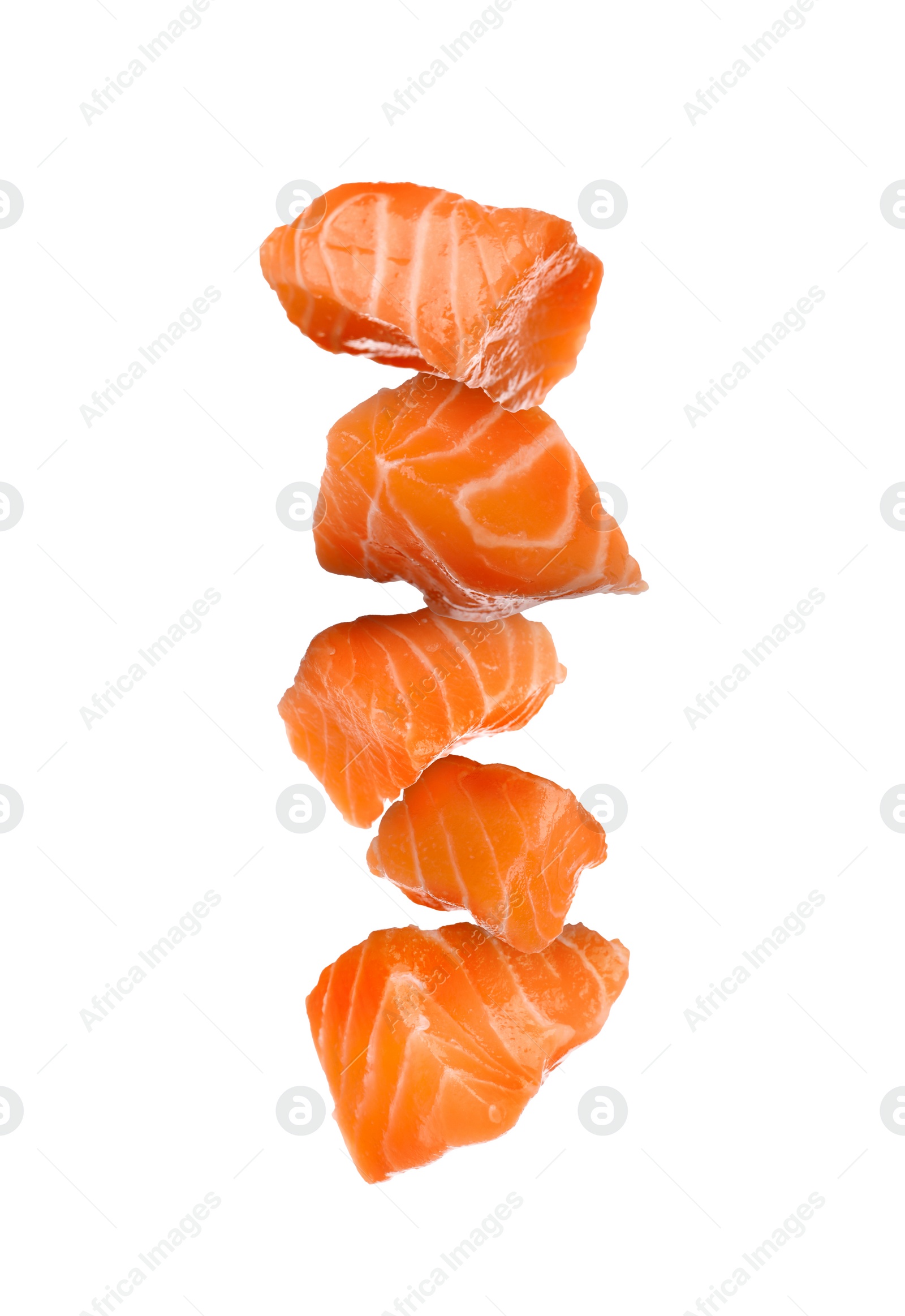 Image of Cut fresh salmon falling on white background