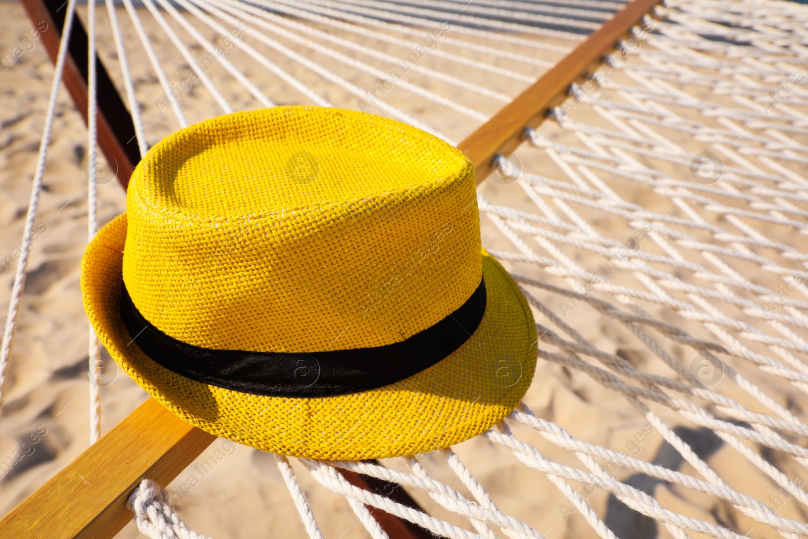 Photo of Hammock and hat at seaside. Time to relax