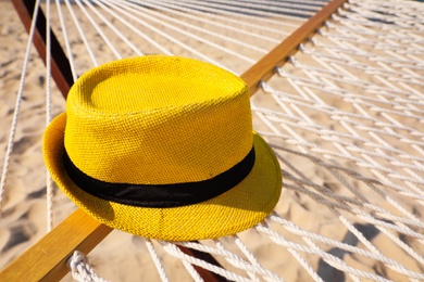 Photo of Hammock and hat at seaside. Time to relax