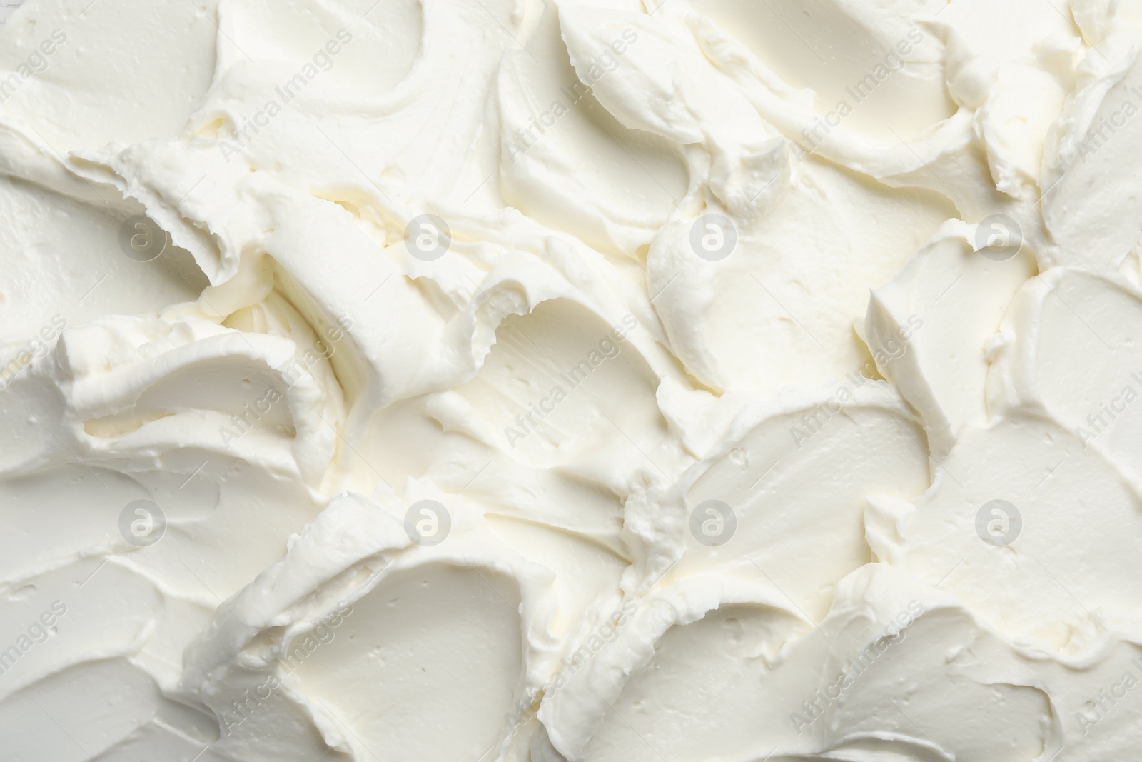 Photo of Closeup of tasty cream cheese as background, top view
