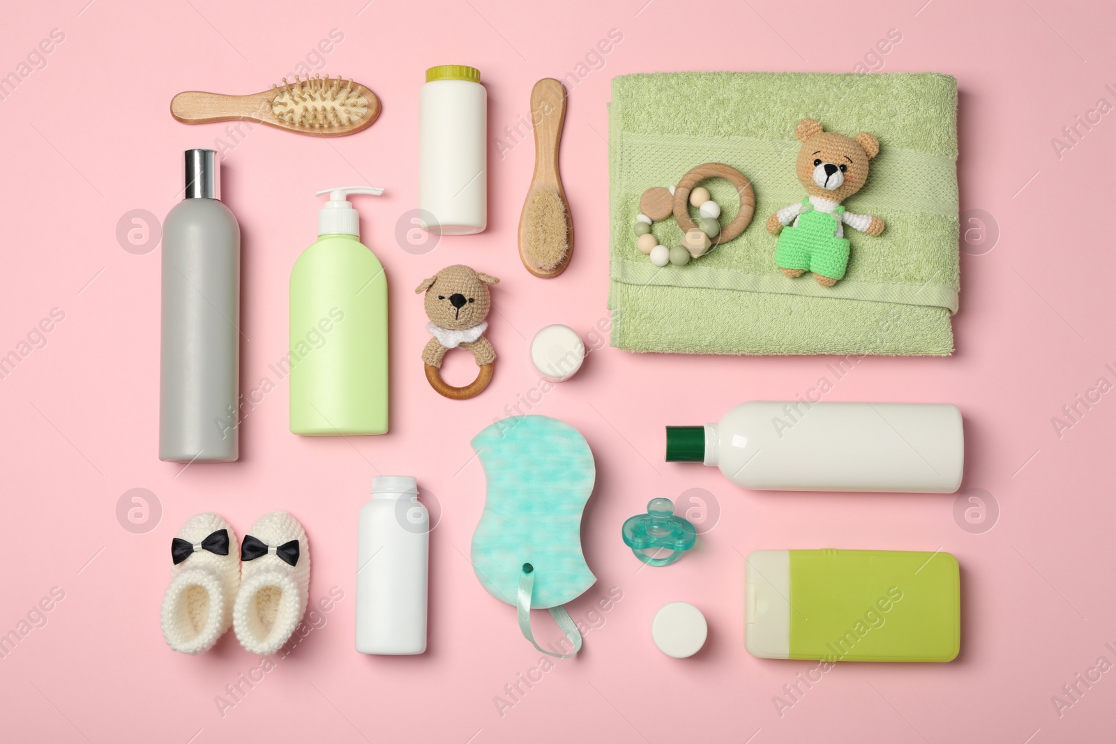 Photo of Flat lay composition with baby cosmetic products on pink background