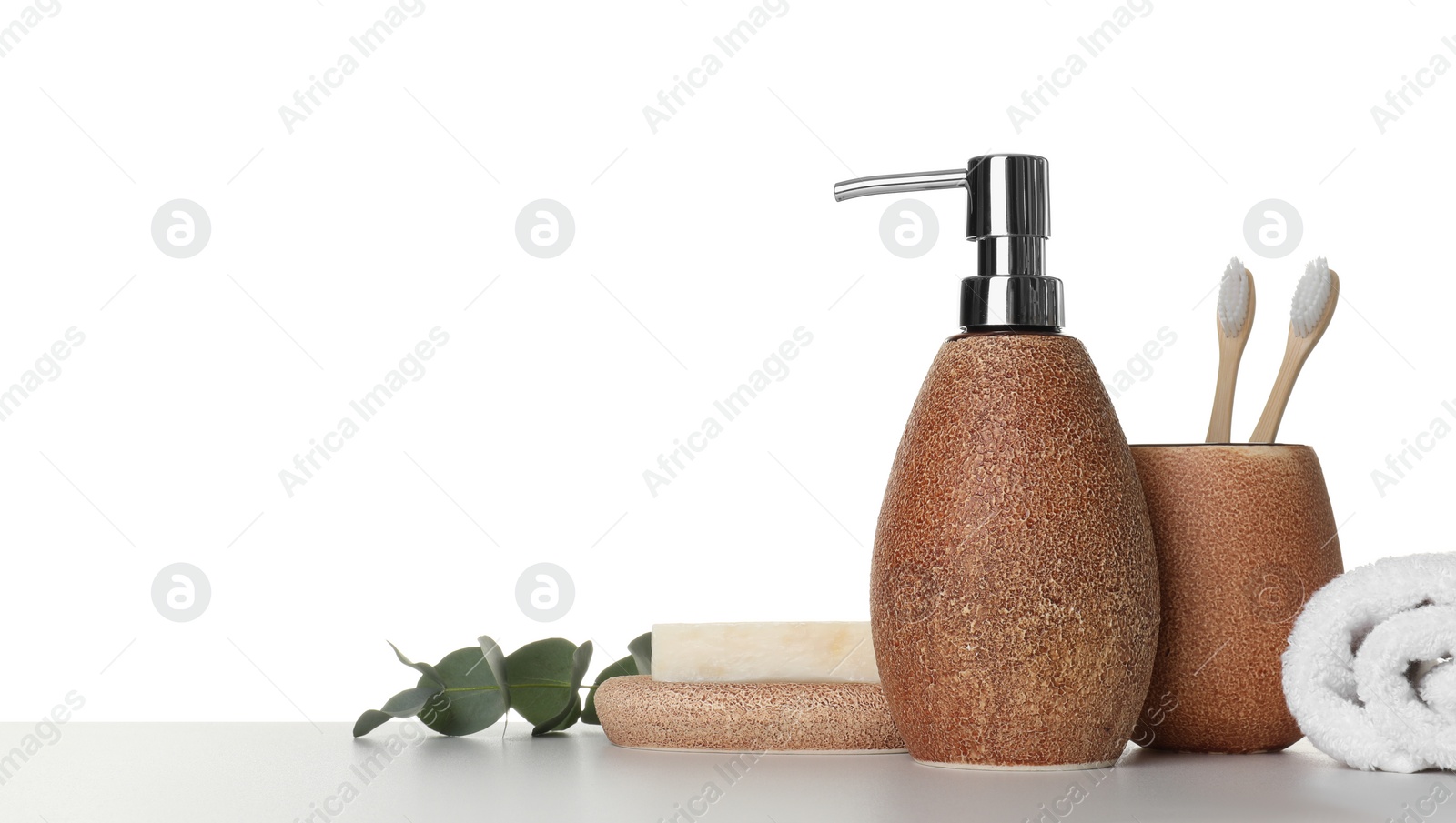 Photo of Bath accessories. Different personal care products and eucalyptus branch on table against white background. Space for text