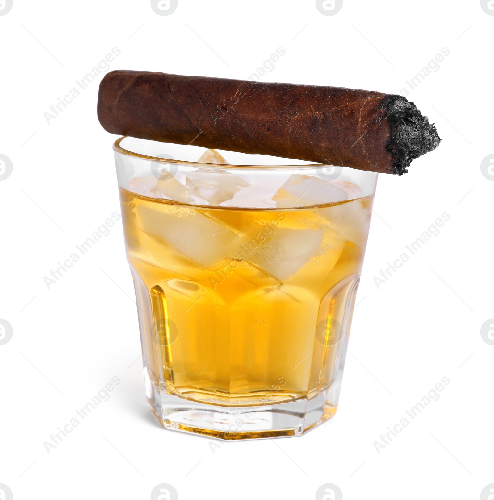 Photo of Glass of whiskey and burnt cigar isolated on white