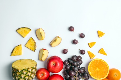 Photo of Rainbow composition with fresh vegetables and fruits on white background, flat lay