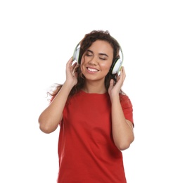 Photo of African-American girl listening to music with headphones on white background