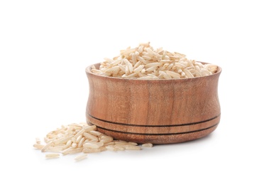 Photo of Wooden bowl with brown rice on white background