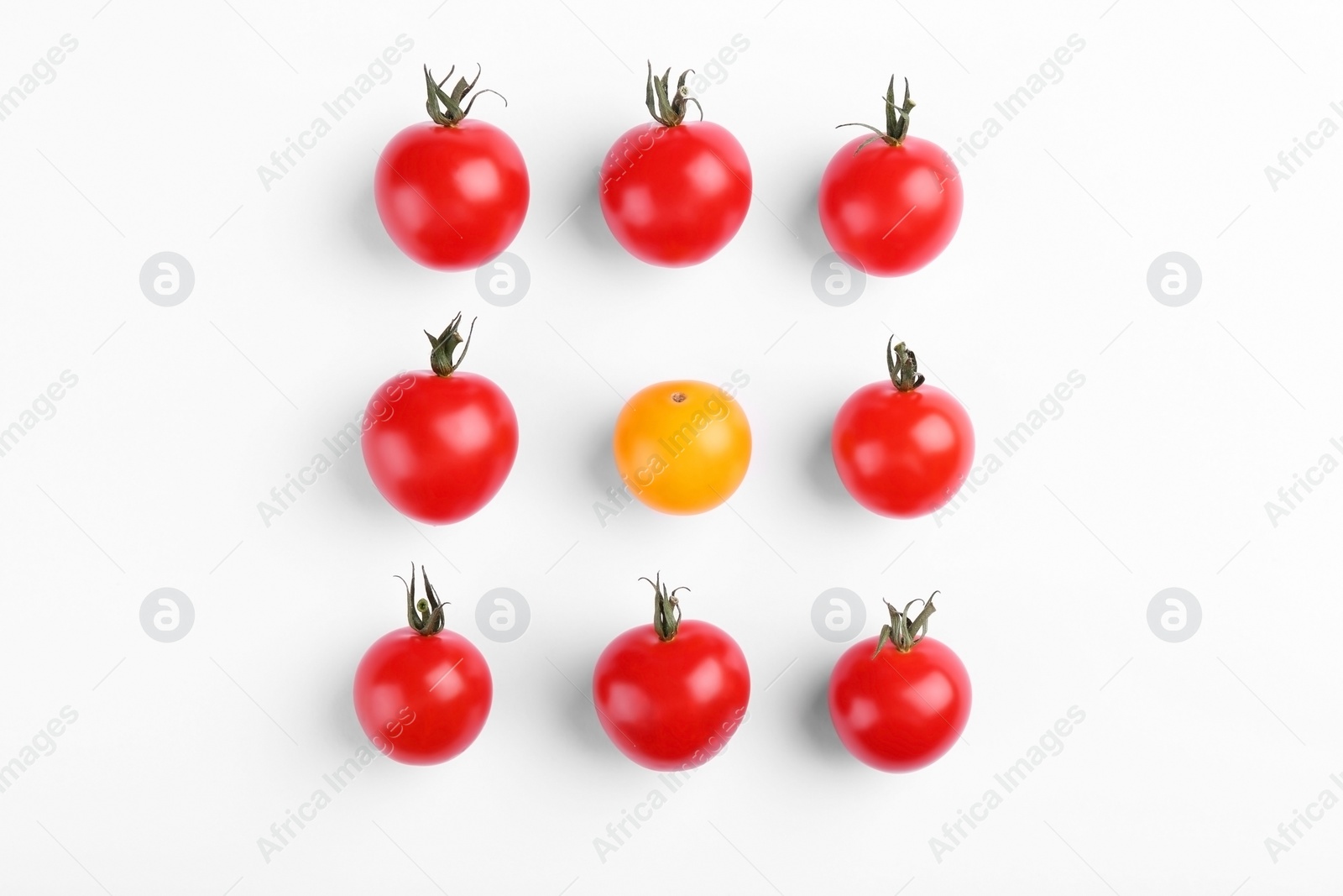 Photo of Red and yellow tomatoes on white background, flat lay
