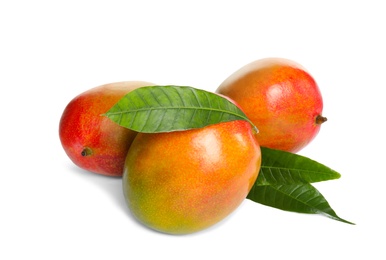 Photo of Delicious ripe mangoes on white background. Tropical fruit