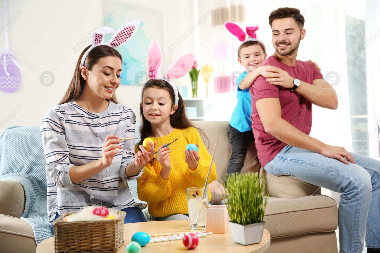 Photo of Happy family preparing for Easter holiday at home