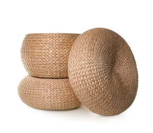 Photo of Three stylish wicker poufs on white background