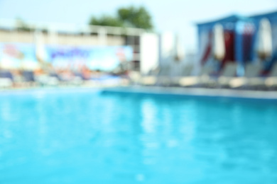 Photo of Blurred view of modern outdoor swimming pool on sunny day