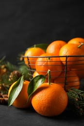 Christmas composition with tangerines on black background