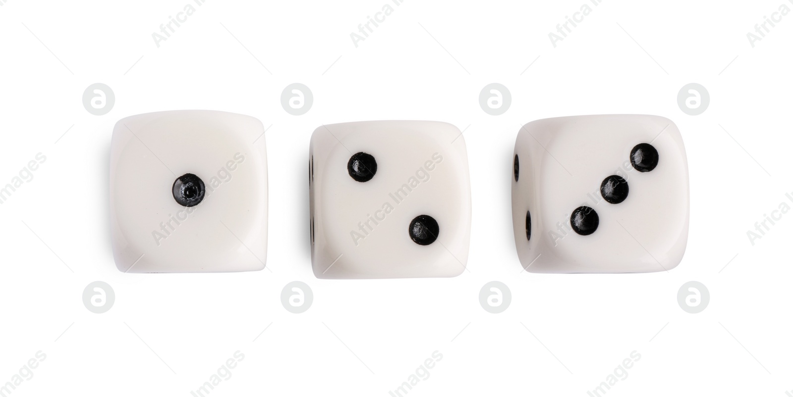 Photo of Three dices isolated on white, top view. Game cubes